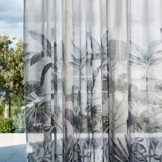Pale translucent sheer with charcoal palm fronds and layered grey jungle foliage