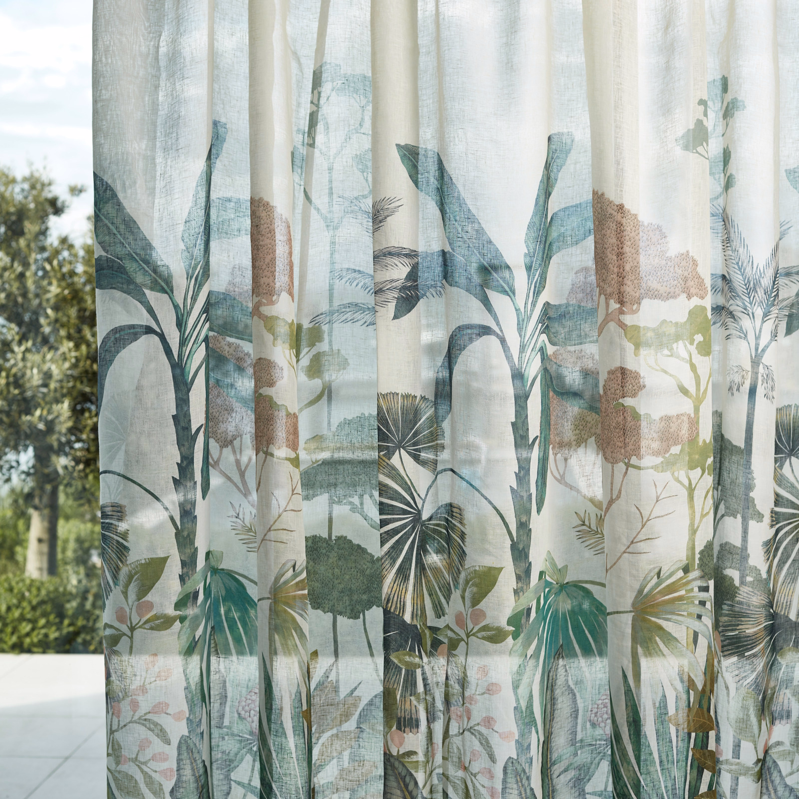 Bleached coral and succulent botanical leaves printed on a pale sheer curtain