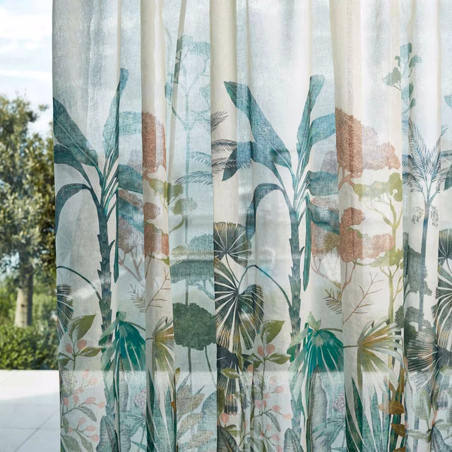 Bleached coral and succulent botanical leaves printed on a pale sheer curtain