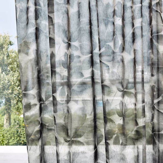 Smoky charcoal sheer curtain with translucent painterly leaves and vertical slub texture