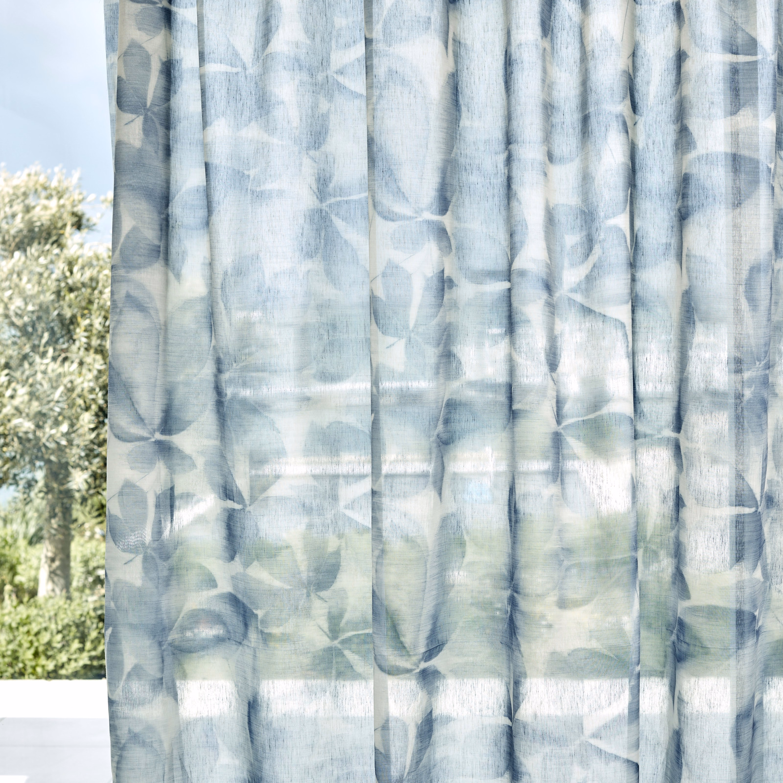 Pale blue-grey sheer with layered translucent oval brush marks and muted green flashes
