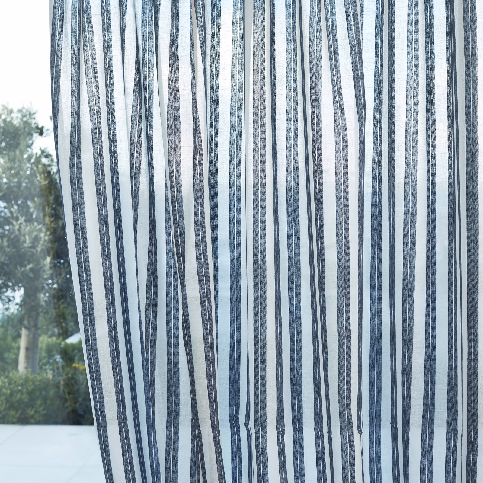 Cool denim-blue vertical striations on a translucent pale blue-grey sheer
