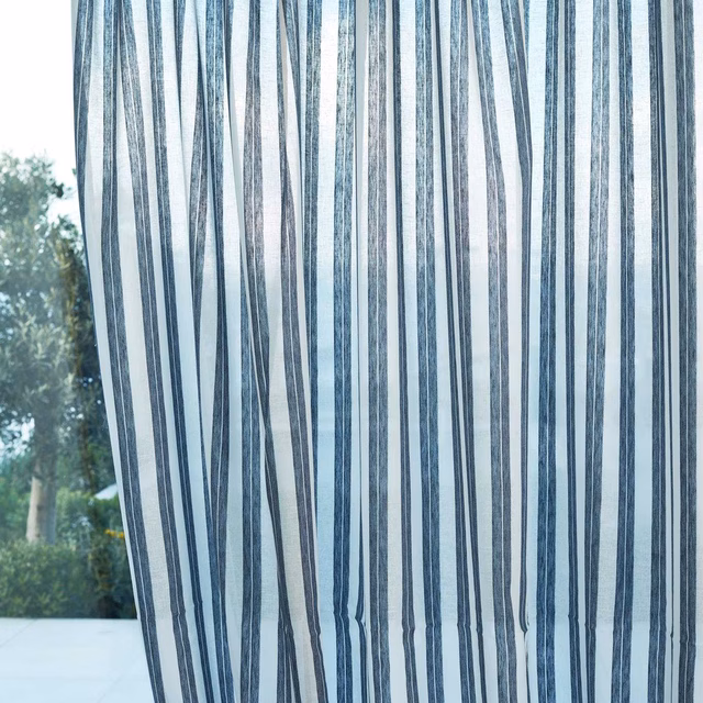 Cool denim-blue vertical striations on a translucent pale blue-grey sheer