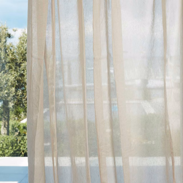 Warm ivory sheer with a fine vertical weave filtering garden light