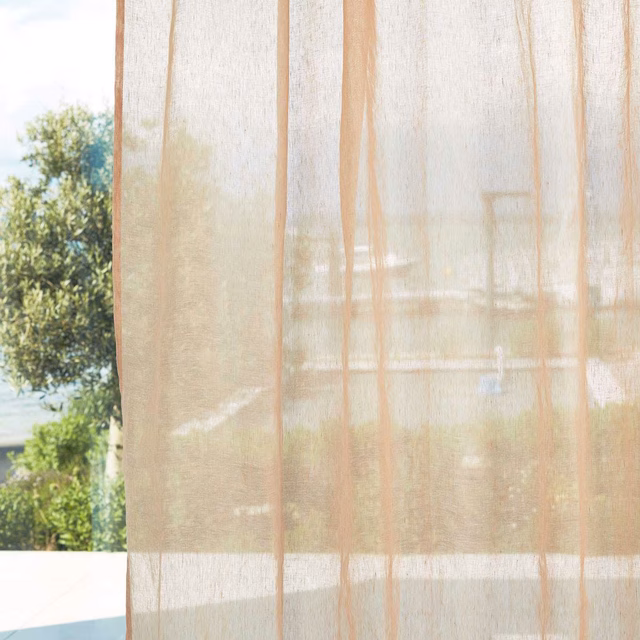 Warm ivory sheer curtain with fine gauze weave and subtle vertical lines in daylight