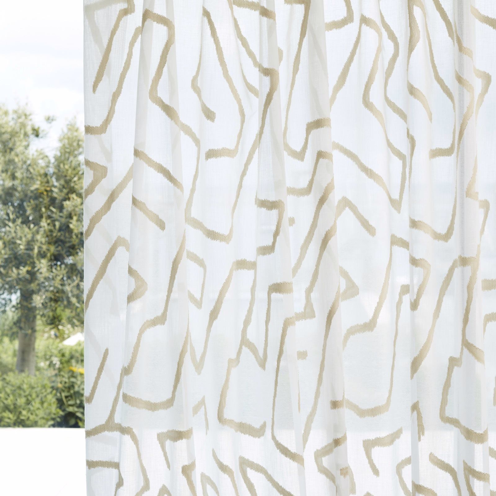 Chalk sheer curtain with irregular parchment lines and visible translucent folds