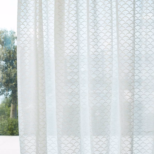 Ivory sheer curtain with pale grey scallop lines and soft vertical folds