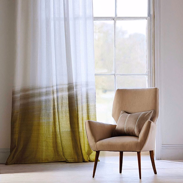 Translucent pistachio sheer fading into shale olive at a sunlit window