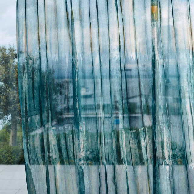 Sheer emerald and stone curtain with vertical painterly striations and saffron glints