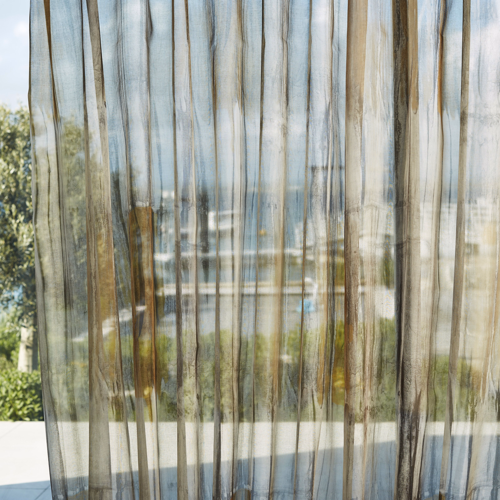 Translucent sheer with saffron, pewter and charcoal vertical striations in sunlight