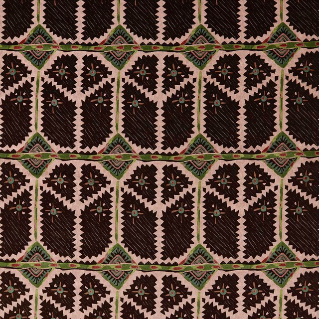 Blush pink ground with charcoal jagged motifs and green-red woven border bands