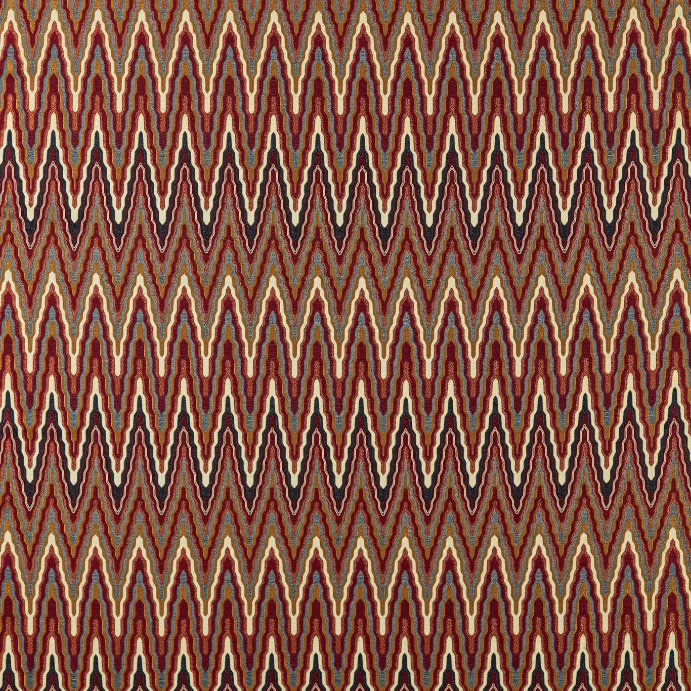 Dense indigo and maroon zigzags edged with cream and olive on woven ground