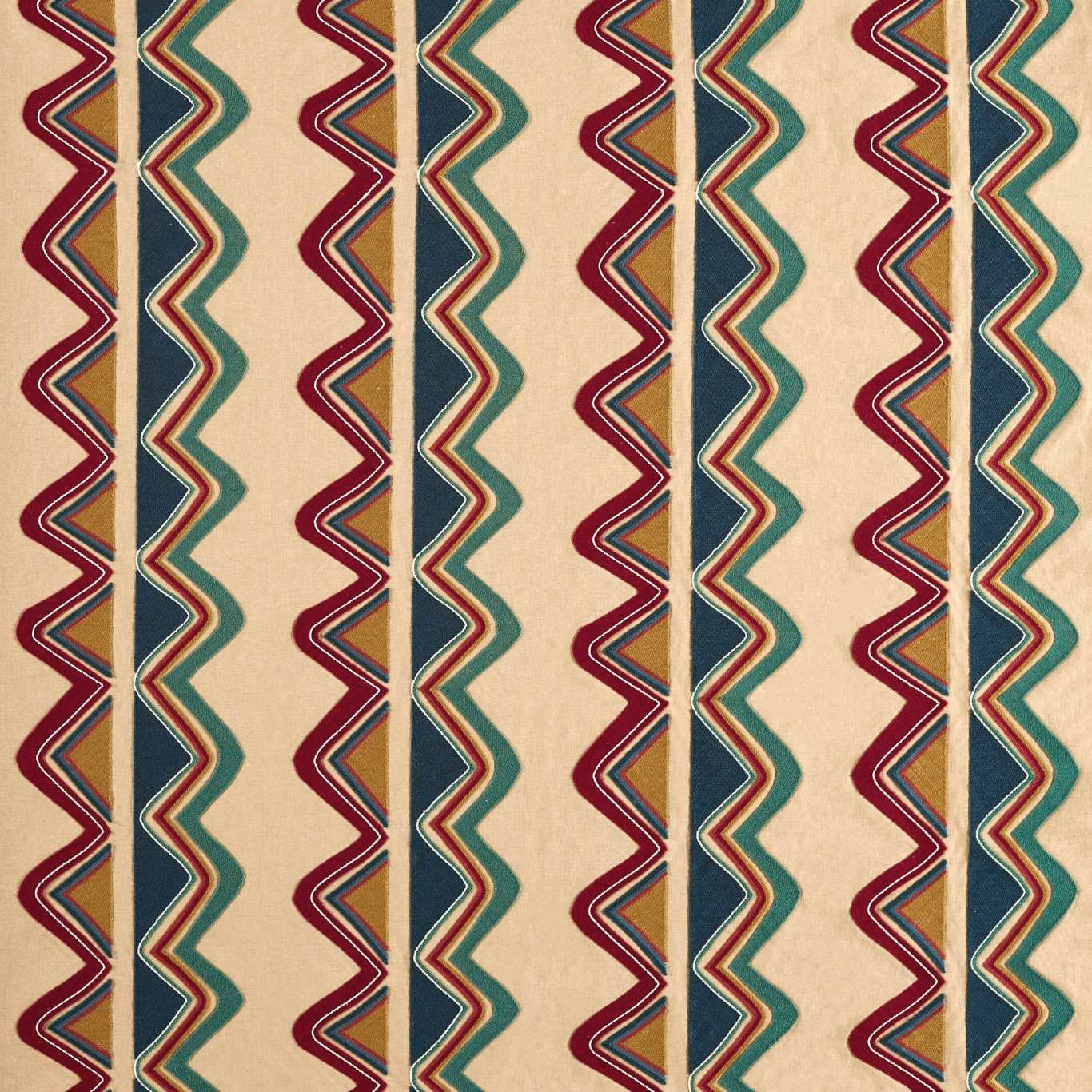 Scarlet and midnight zigzag bands with teal accents on a warm cream woven ground