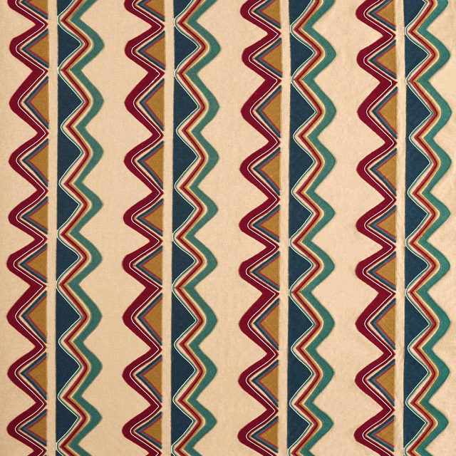 Scarlet and midnight zigzag bands with teal accents on a warm cream woven ground