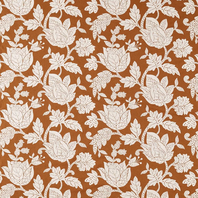 Warm terracotta fabric with cream outlined flowers and leafy botanical repeat