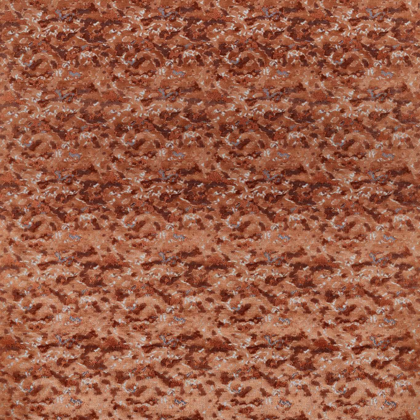 Warm rust woven fabric with pale blue flecks and irregular horizontal motifs