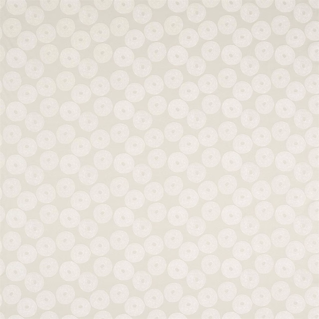 Soft oyster cream textile with evenly spaced textured circular motifs and a gently woven surface