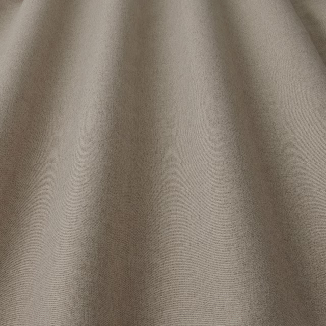 Close-up of warm biscuit beige woven fabric with a soft matte texture