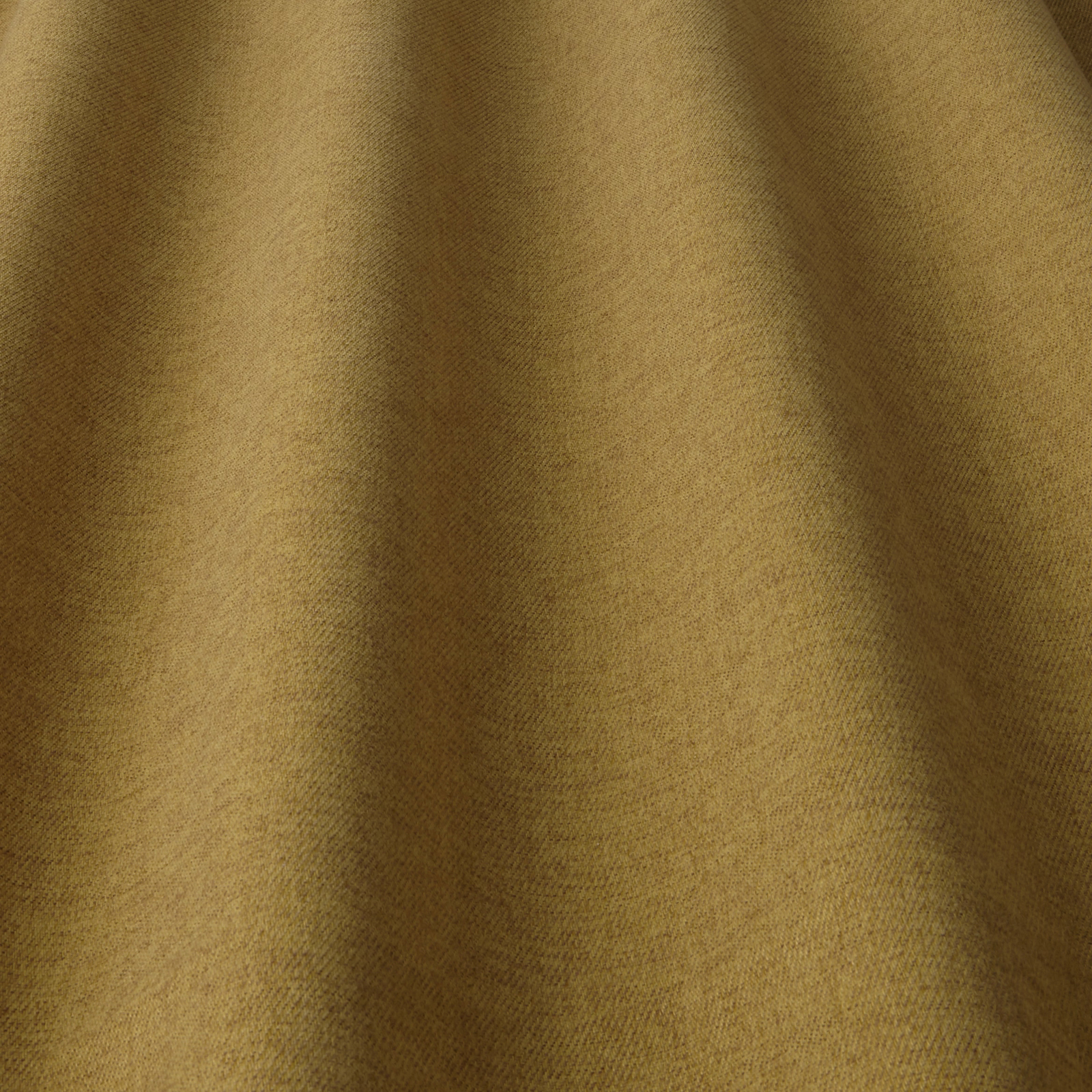 Mellow ochre-gold plain woven fabric with soft folded shadows