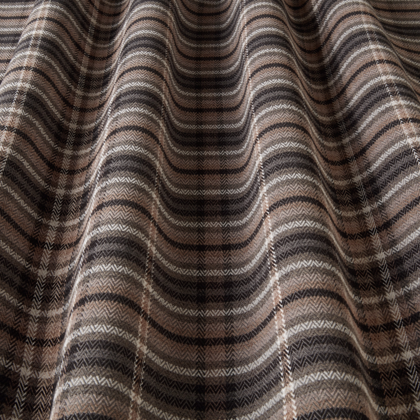 Charcoal and taupe chevron-woven fabric swatch with rippled folds