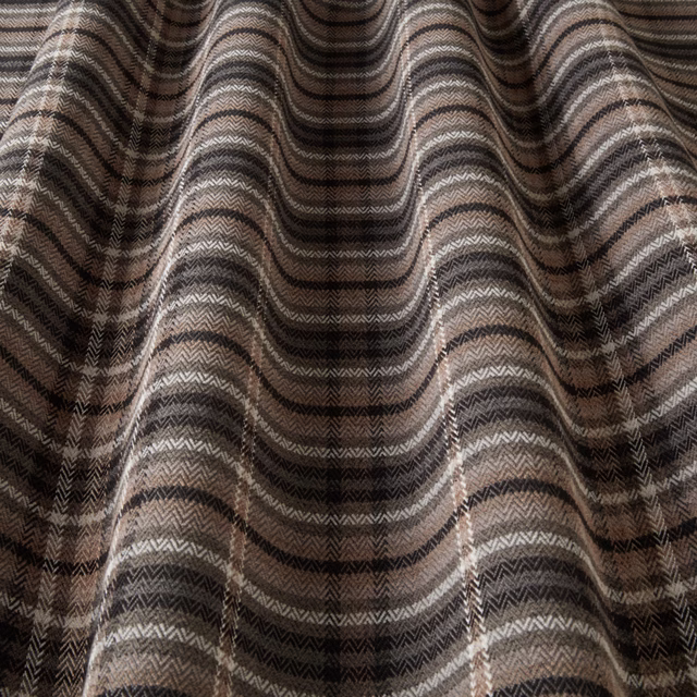 Charcoal and taupe chevron-woven fabric swatch with rippled folds