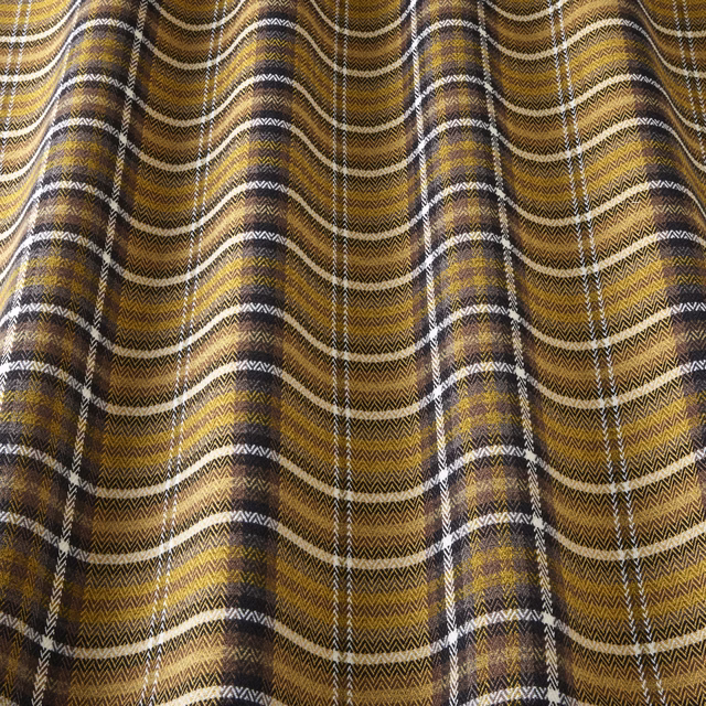 Ochre and brown woven check fabric with ivory stripes in soft folds