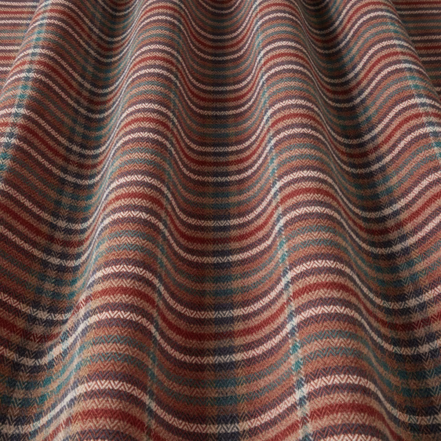 Wavy woven stripe fabric in terracotta, teal, cream and brown