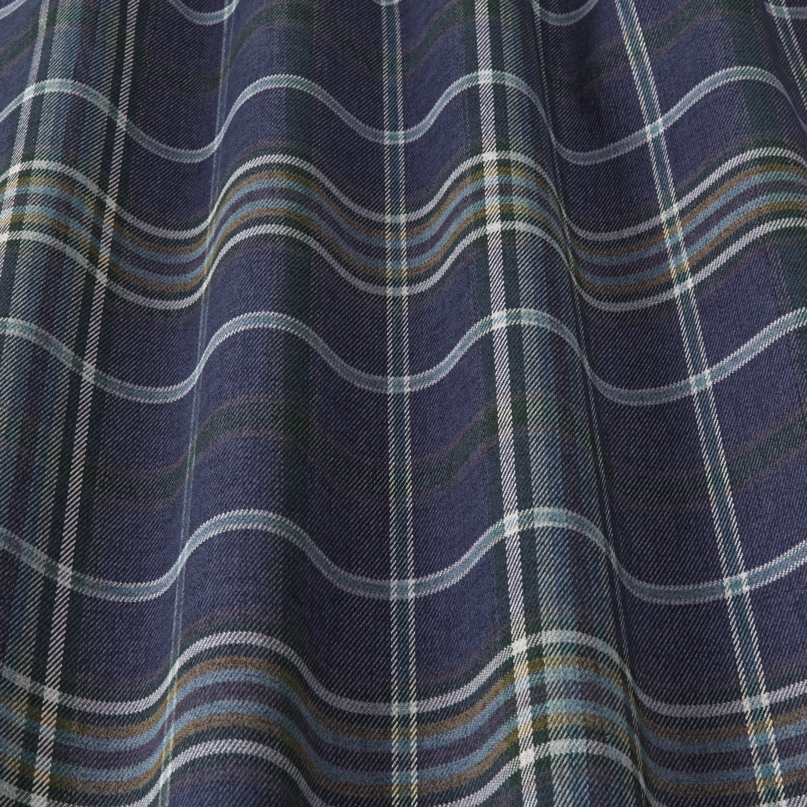Deep indigo checked fabric with pale blue, grey and teal stripes