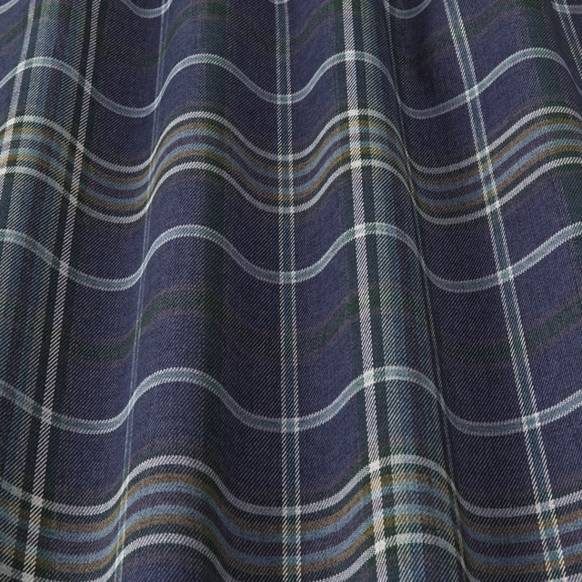 Deep indigo checked fabric with pale blue, grey and teal stripes