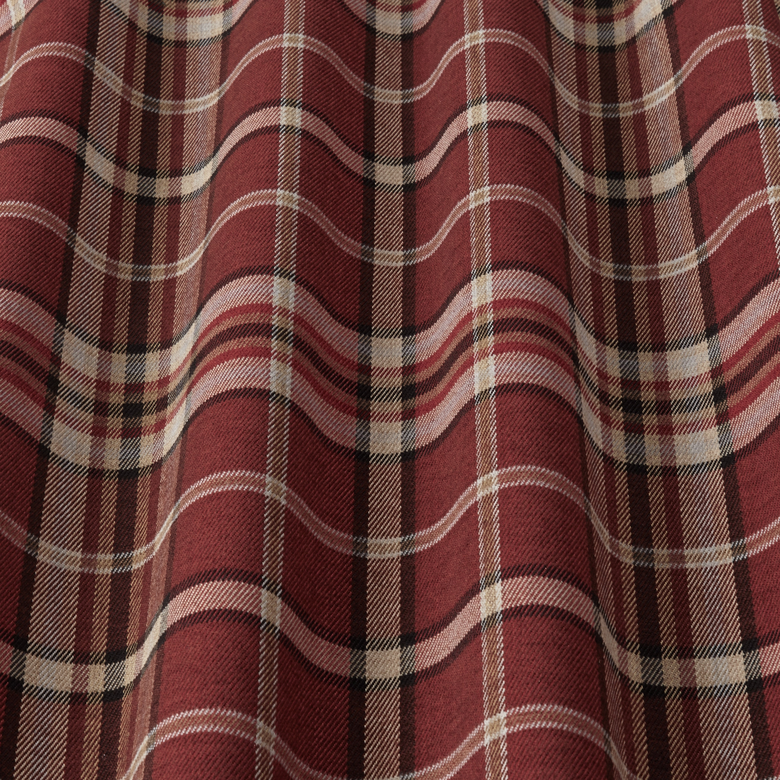 Close-up of a wine red tartan check fabric with cream and dark brown stripes