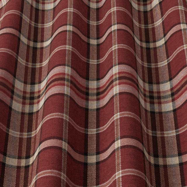 Close-up of a wine red tartan check fabric with cream and dark brown stripes