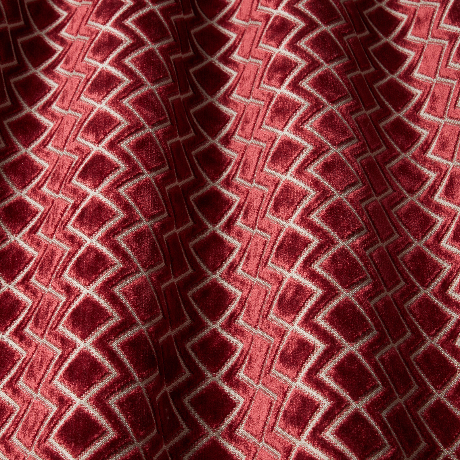 Deep claret velvet swatch with wavy geometric pattern and pale outlines