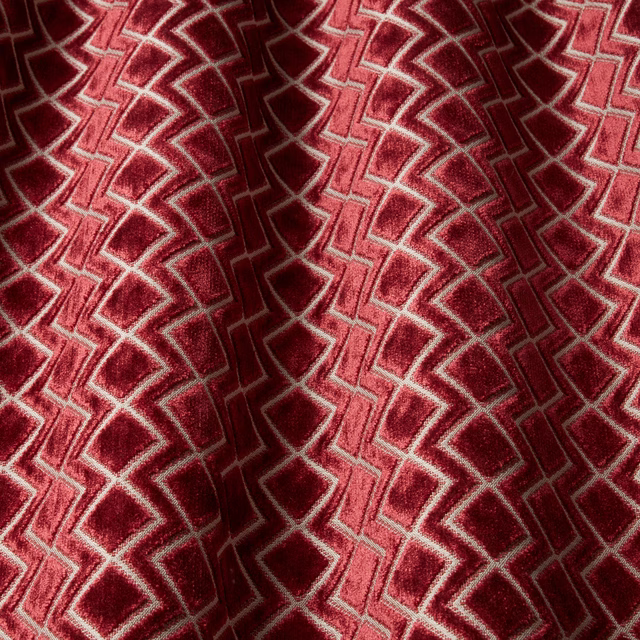 Deep claret velvet swatch with wavy geometric pattern and pale outlines