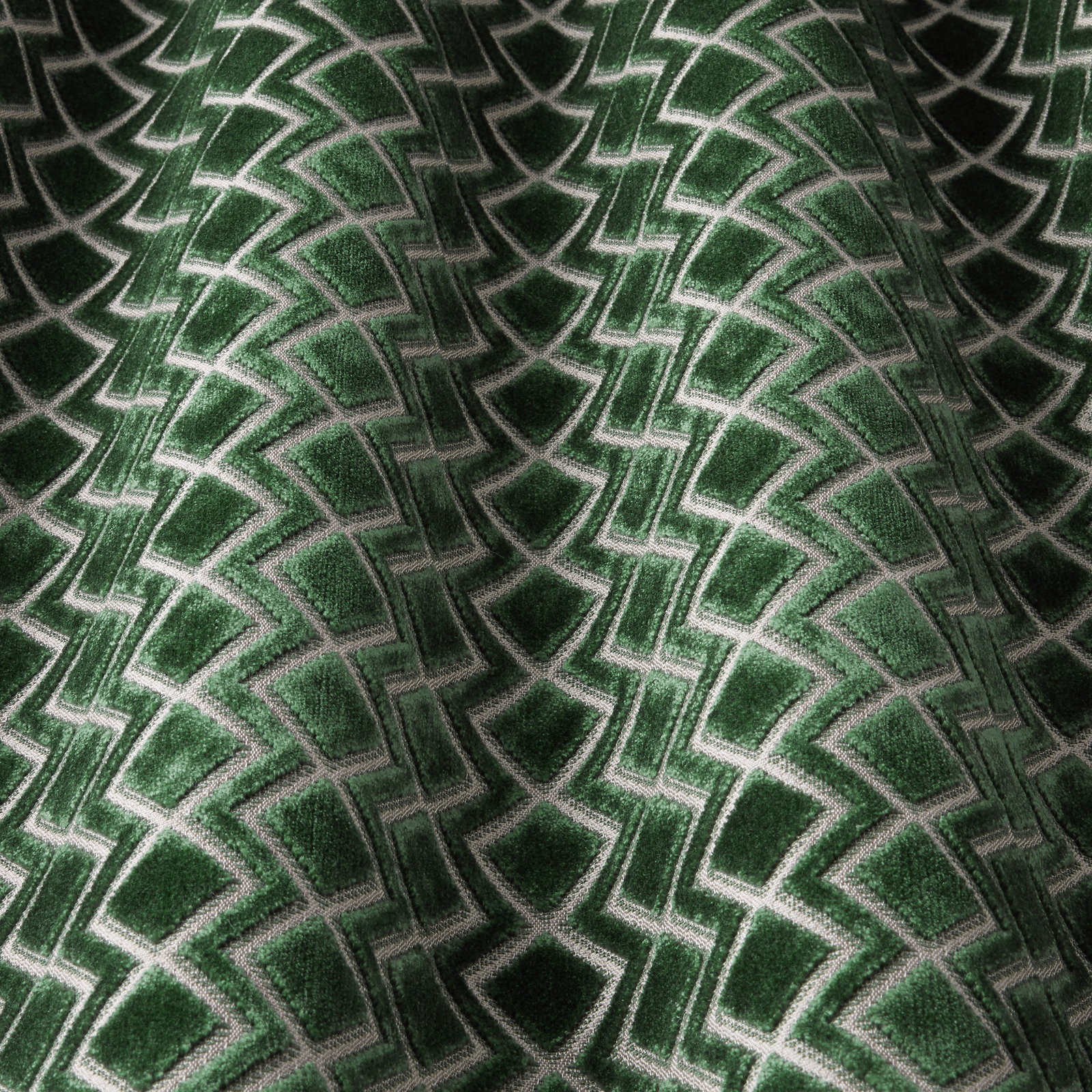 Deep jade geometric velvet with pale wavy outlines and a soft pile sheen