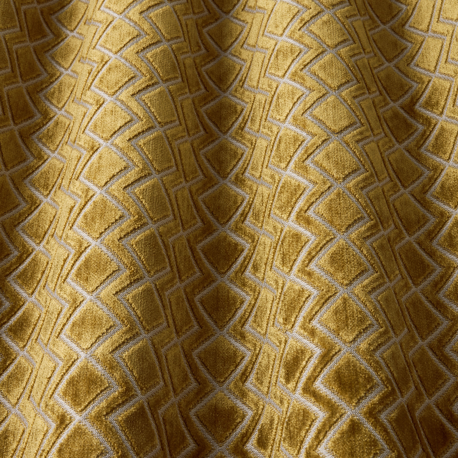 Golden saffron velvet with raised wavy geometric pattern and soft sheen