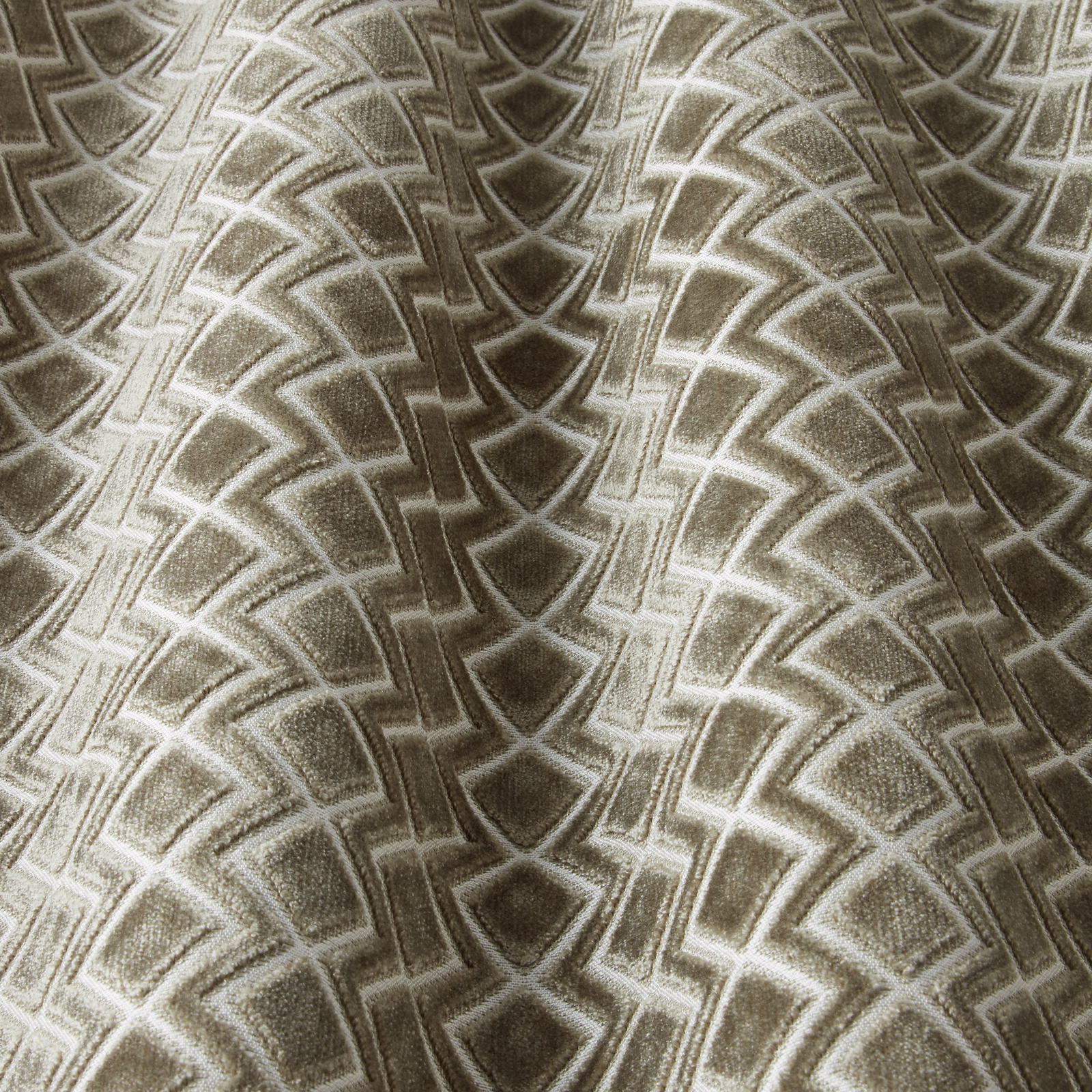 Taupe velvet swatch with repeating wavy geometric arcs and soft sheen