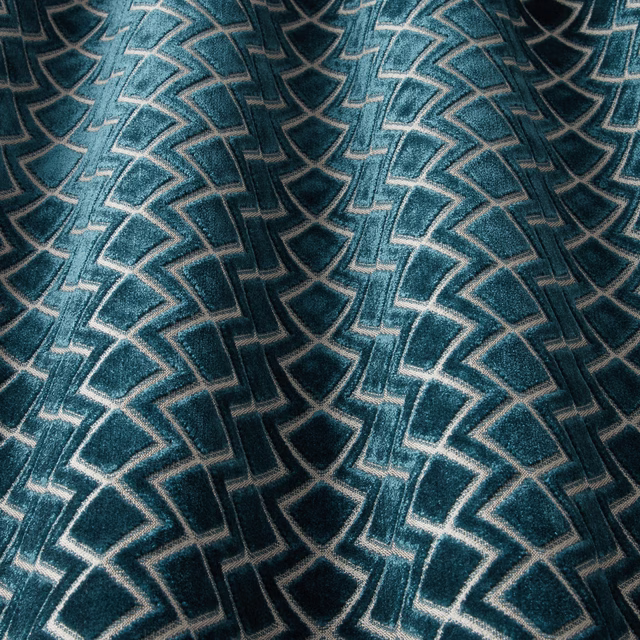 Deep teal velvet with scalloped geometric arches and pale linear outlines