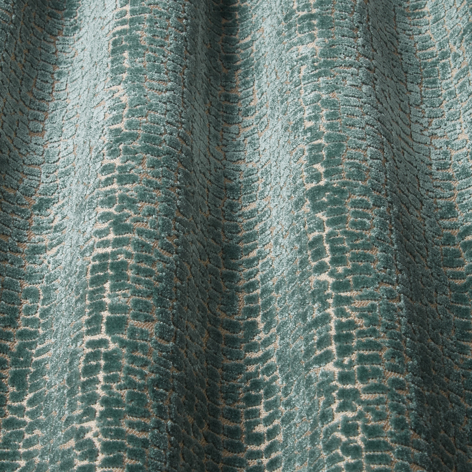 Teal velvet with raised wavy pattern and pale tonal highlights