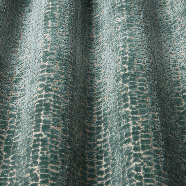 Teal velvet with raised wavy pattern and pale tonal highlights