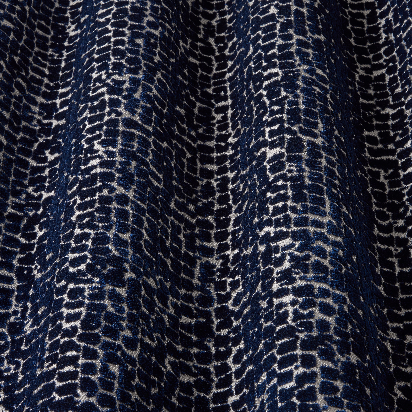 Deep midnight blue velvet with pale cracked wave pattern