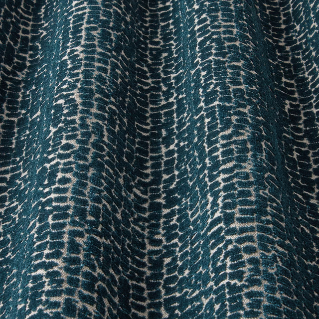 Deep teal velvet swatch with ivory wavy lattice pattern and soft sheen