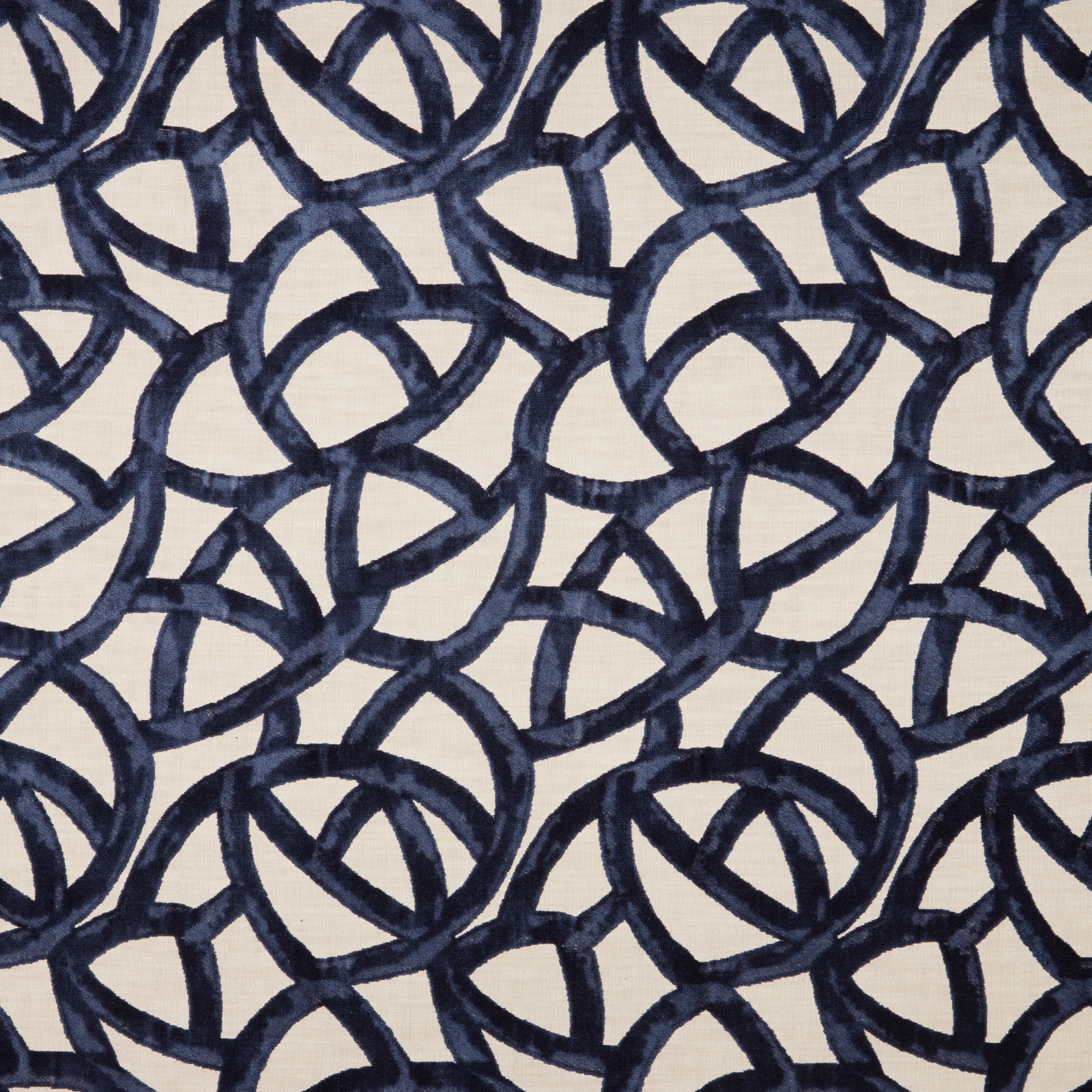 Ivory velvet ground with interlocking deep navy looped geometric pattern