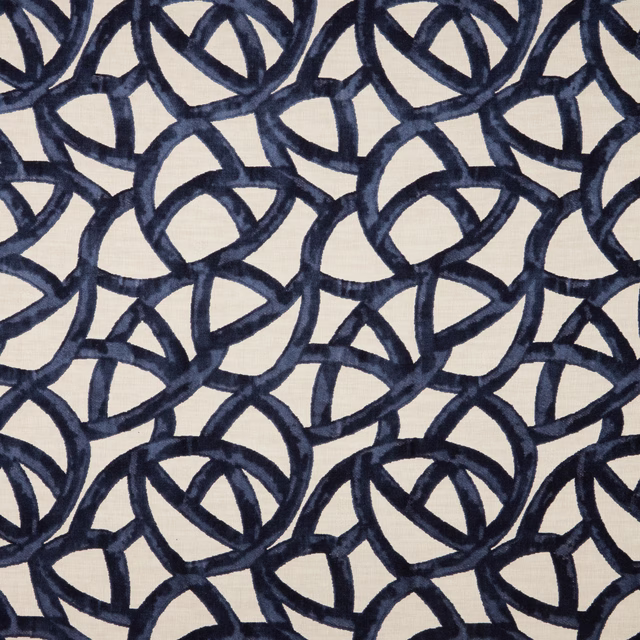 Ivory velvet ground with interlocking deep navy looped geometric pattern