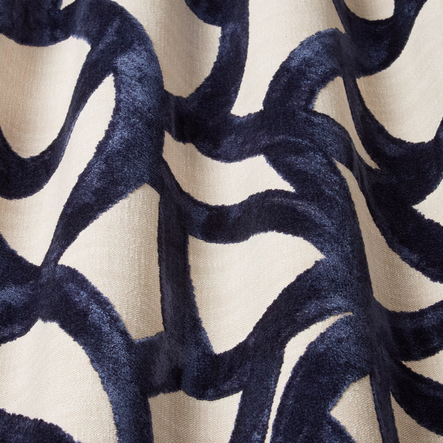 Deep midnight-blue velvet wavy motif on a pale ivory ground