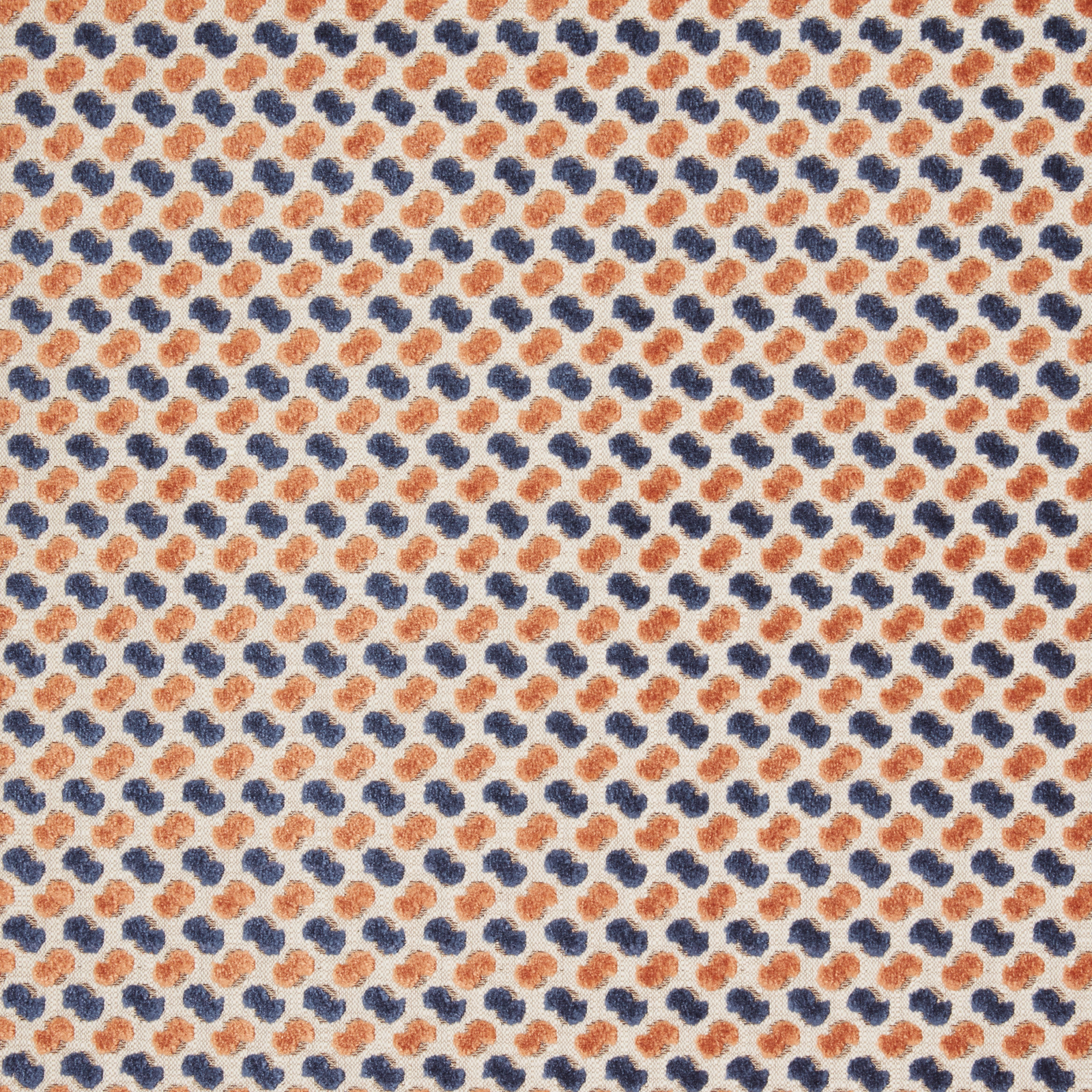 Pale velvet fabric with repeating midnight blue and rust looped motifs