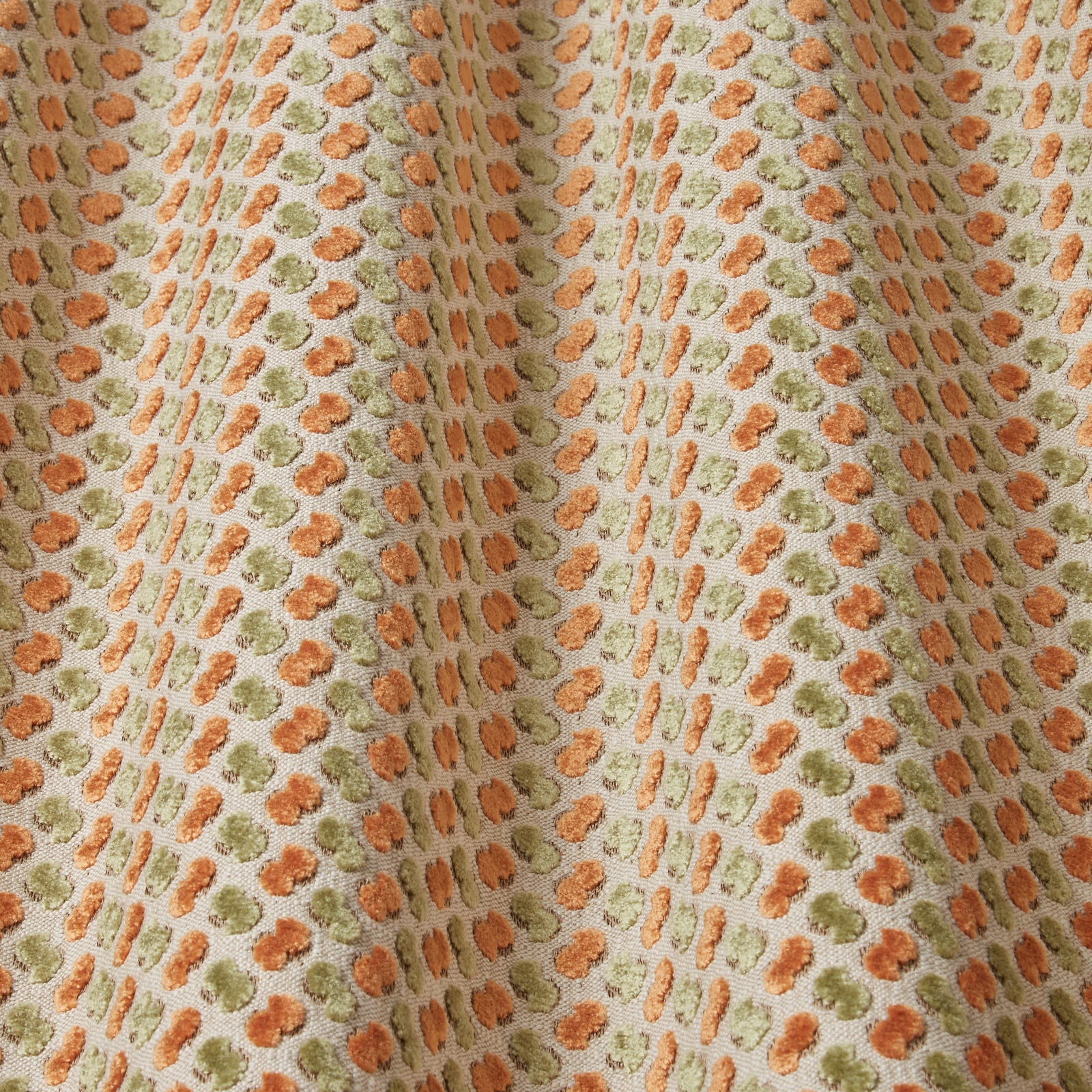 Spotted sienna and sage velvet with a soft neutral ground and sheen