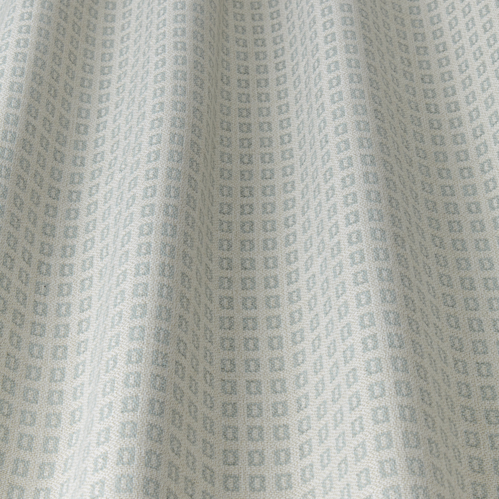 Pale duckegg blue geometric fabric with tiny square motif and soft drape