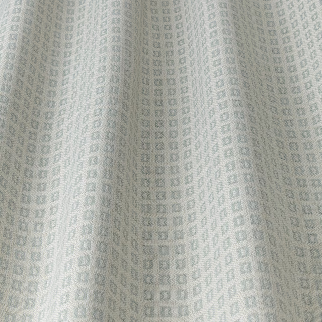 Pale duckegg blue geometric fabric with tiny square motif and soft drape