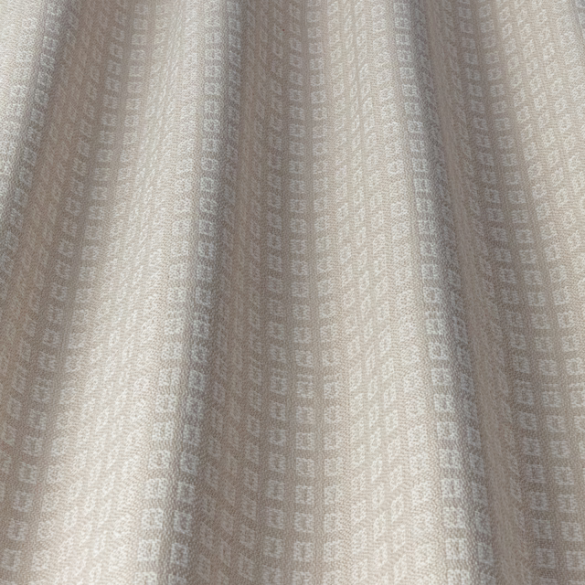 Soft ivory woven fabric with tiny tonal square geometric repeat