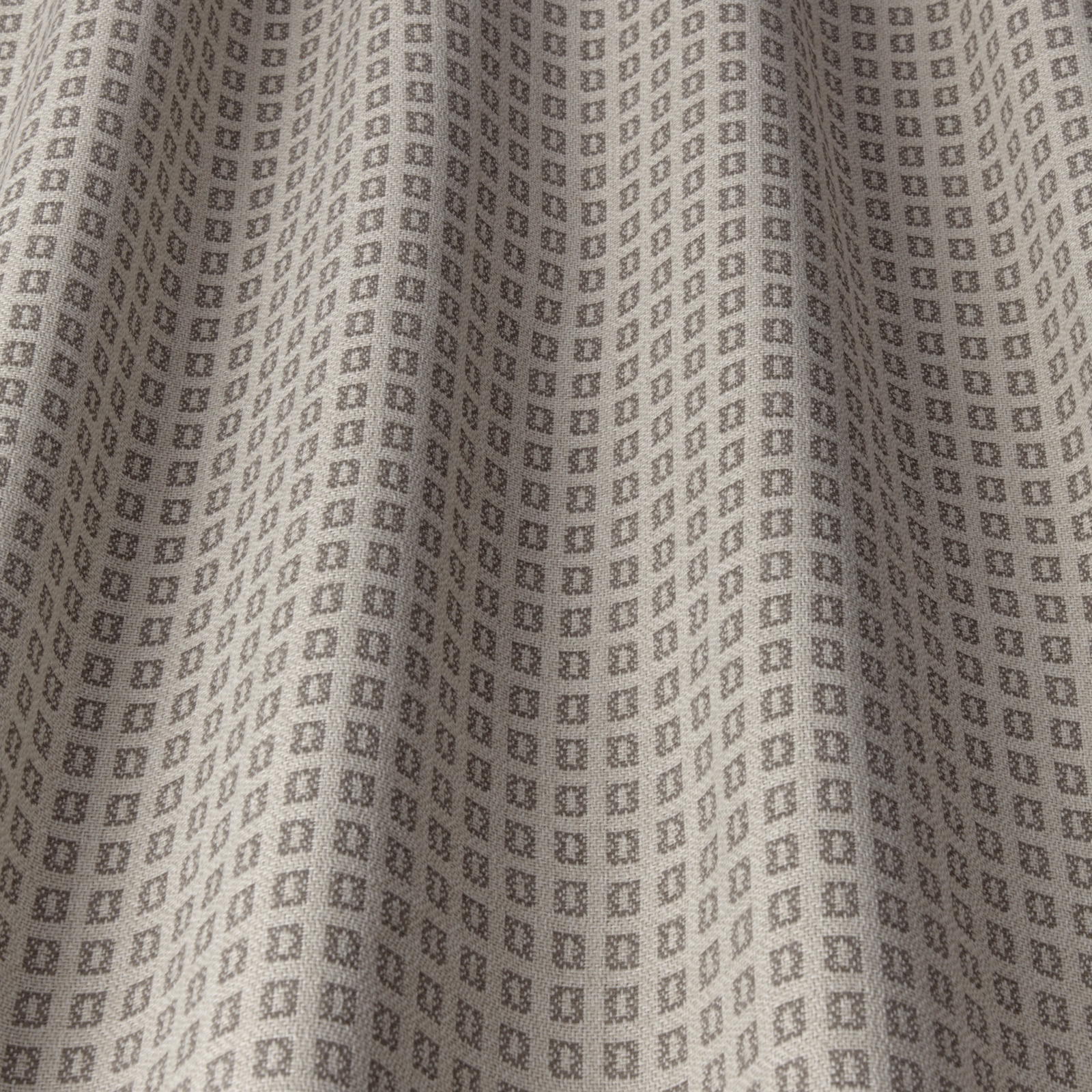 Warm taupe woven fabric with a small square geometric repeat